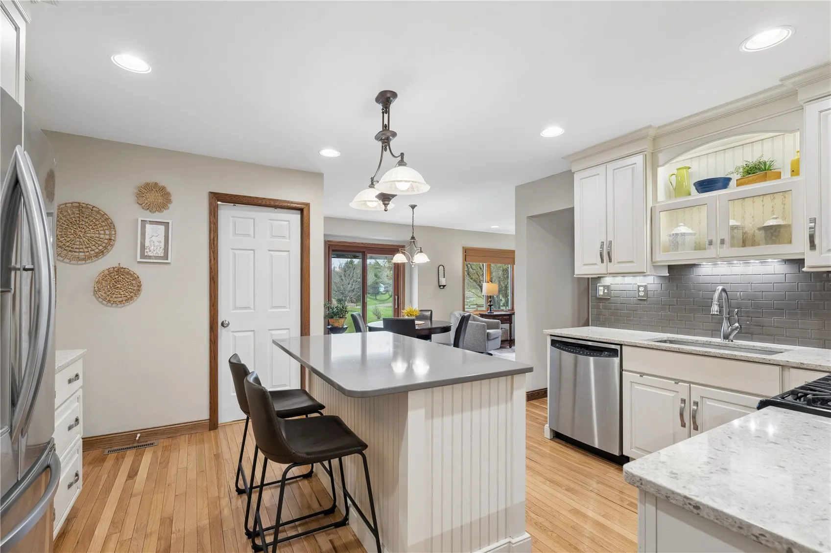 Breakfast bar on island in addition to adjoining casual dining area