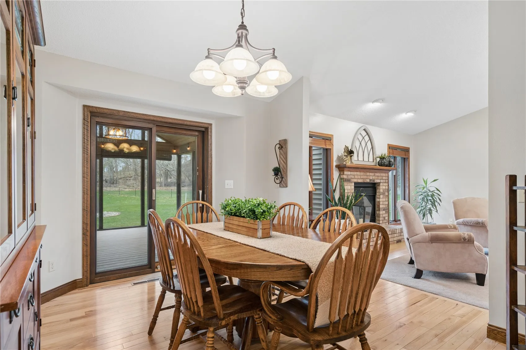 Dining room looks to living room and screened porch