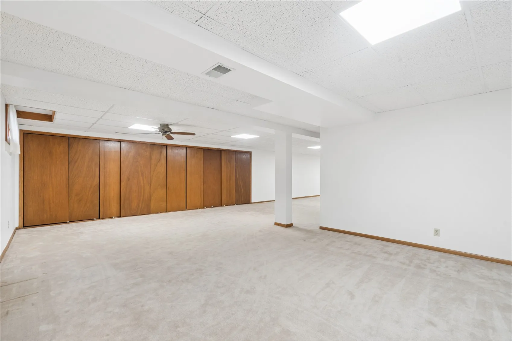 Lower level family room with storage closets