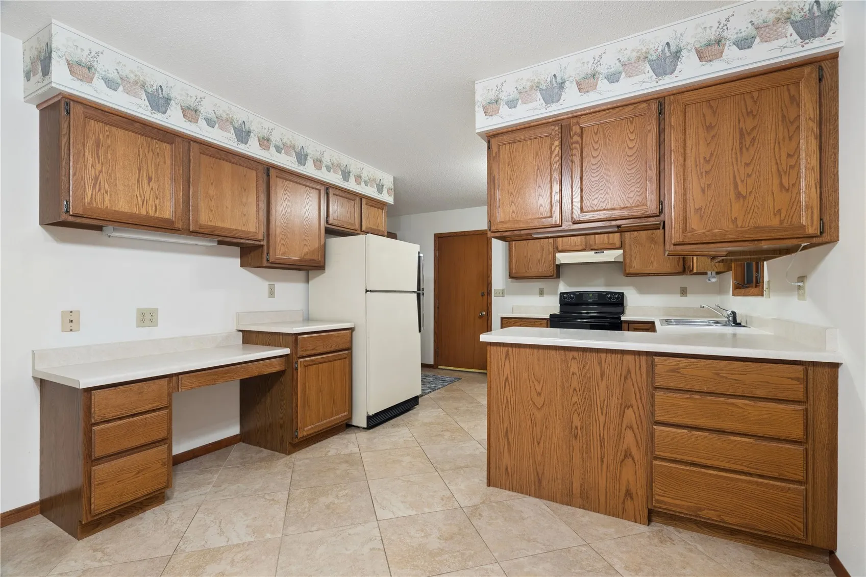 Kitchen area with first floor laundry in kitchen