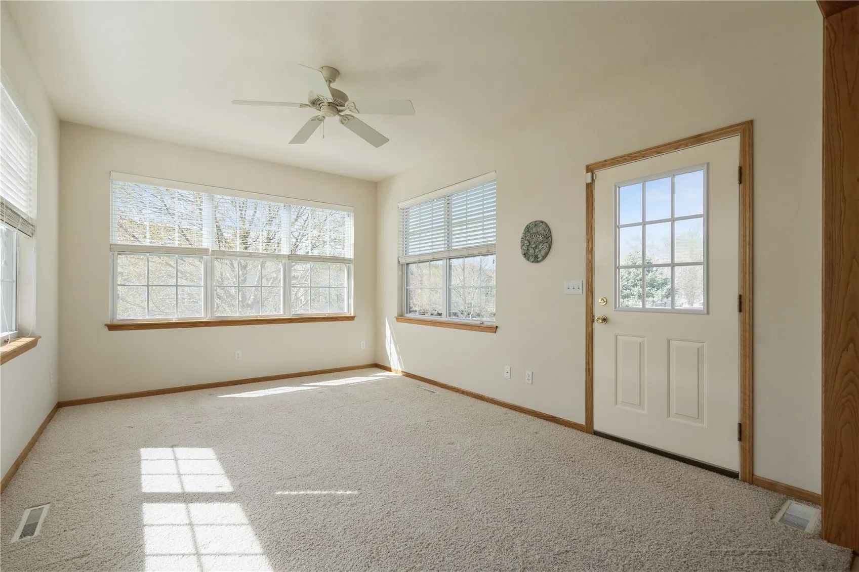 Sunlight floods this beautiful sunroom!