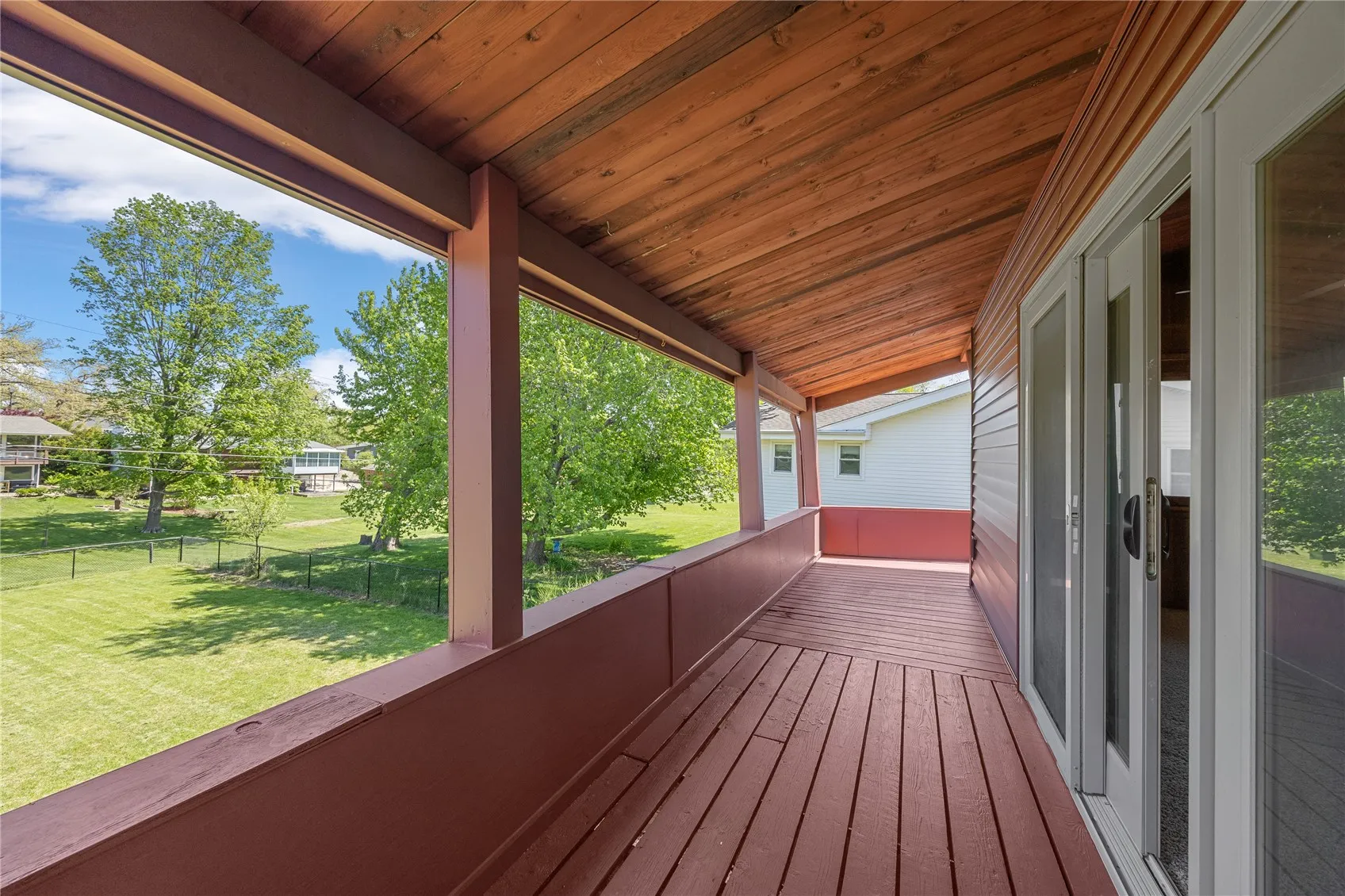 Wrap around deck with access by two sliding doors from the great room or from the cement patio,