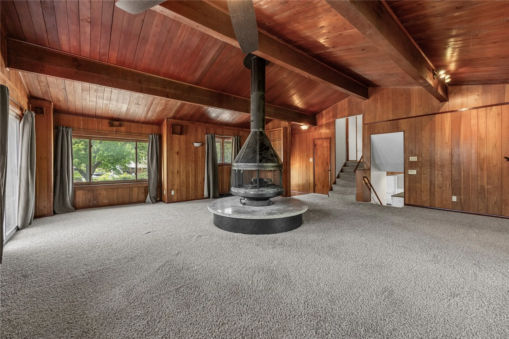 Great room with gas fireplace looking to the northeast. There are a LOT of windows in this room.