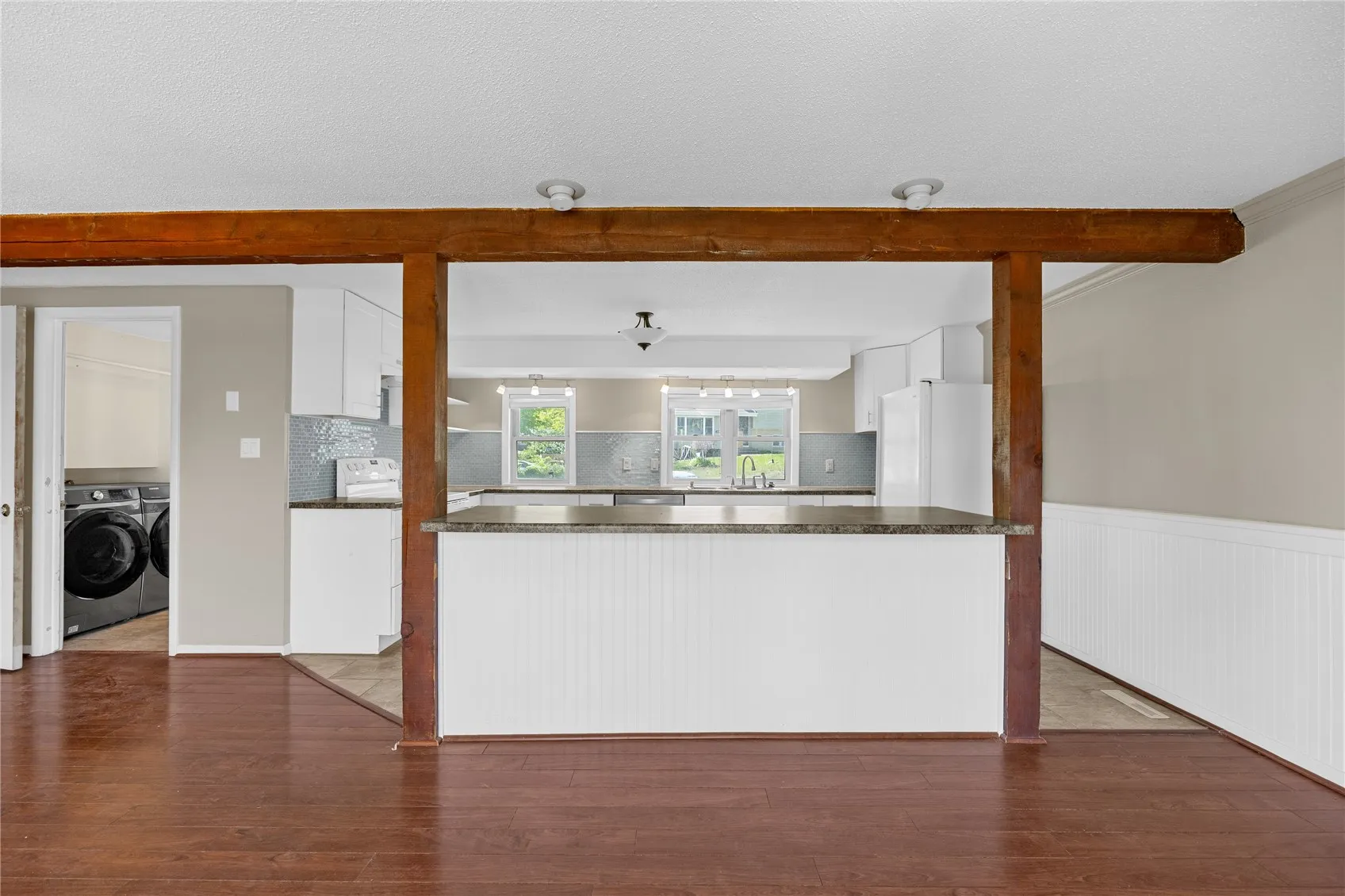 This is a view from the walkout sliding doors. On the left is the laundry room and a full bath. Stright ahead is the breakfast island.