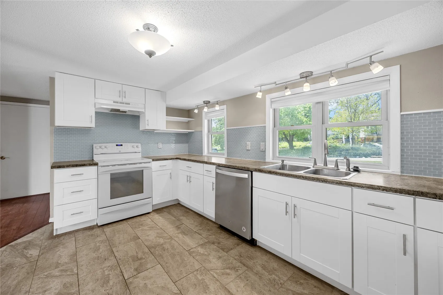 Kitchen area with all appliances staying with the buyer. Plenty of storage space!
