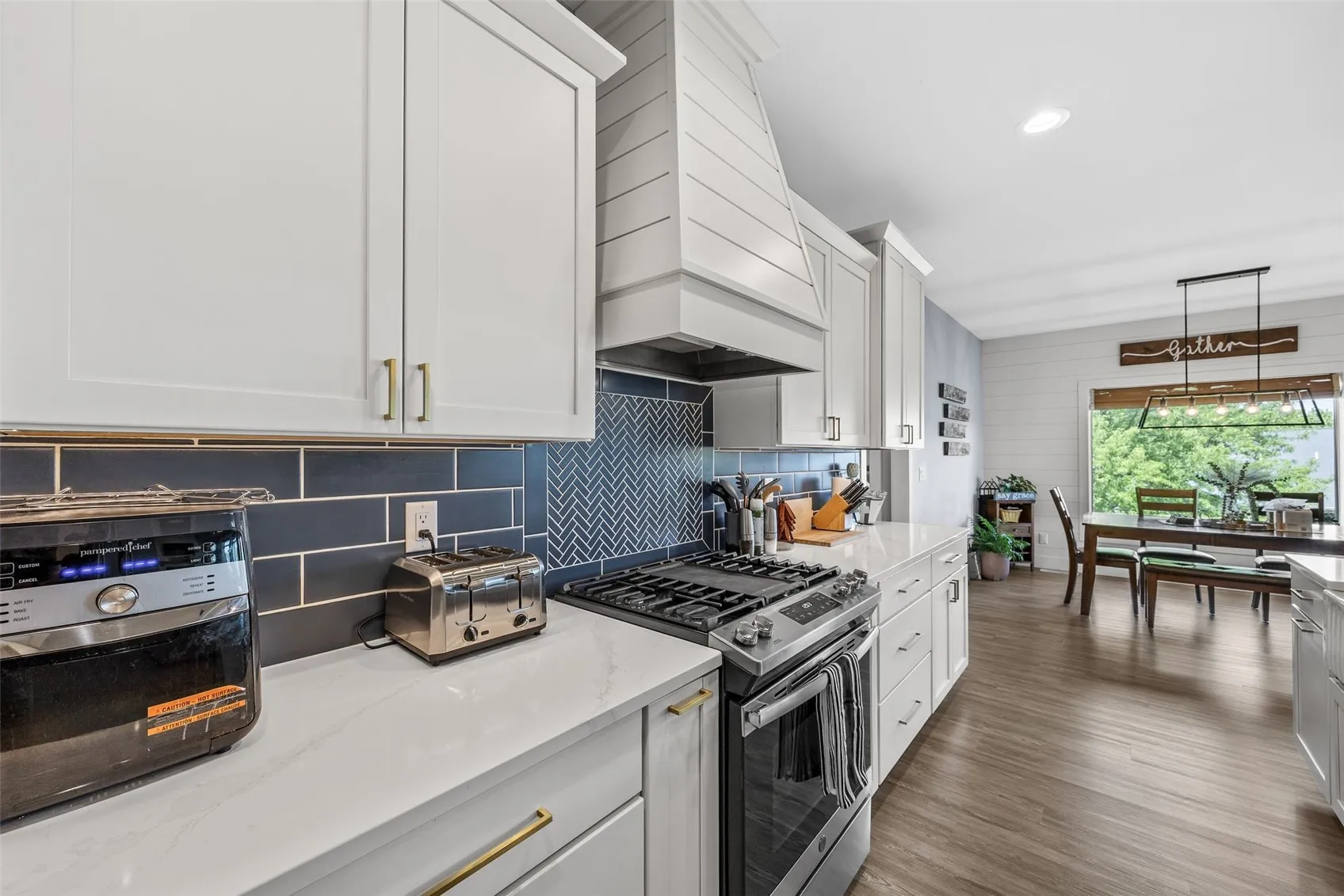 Custom cabinets and newer stove that stays with property.
