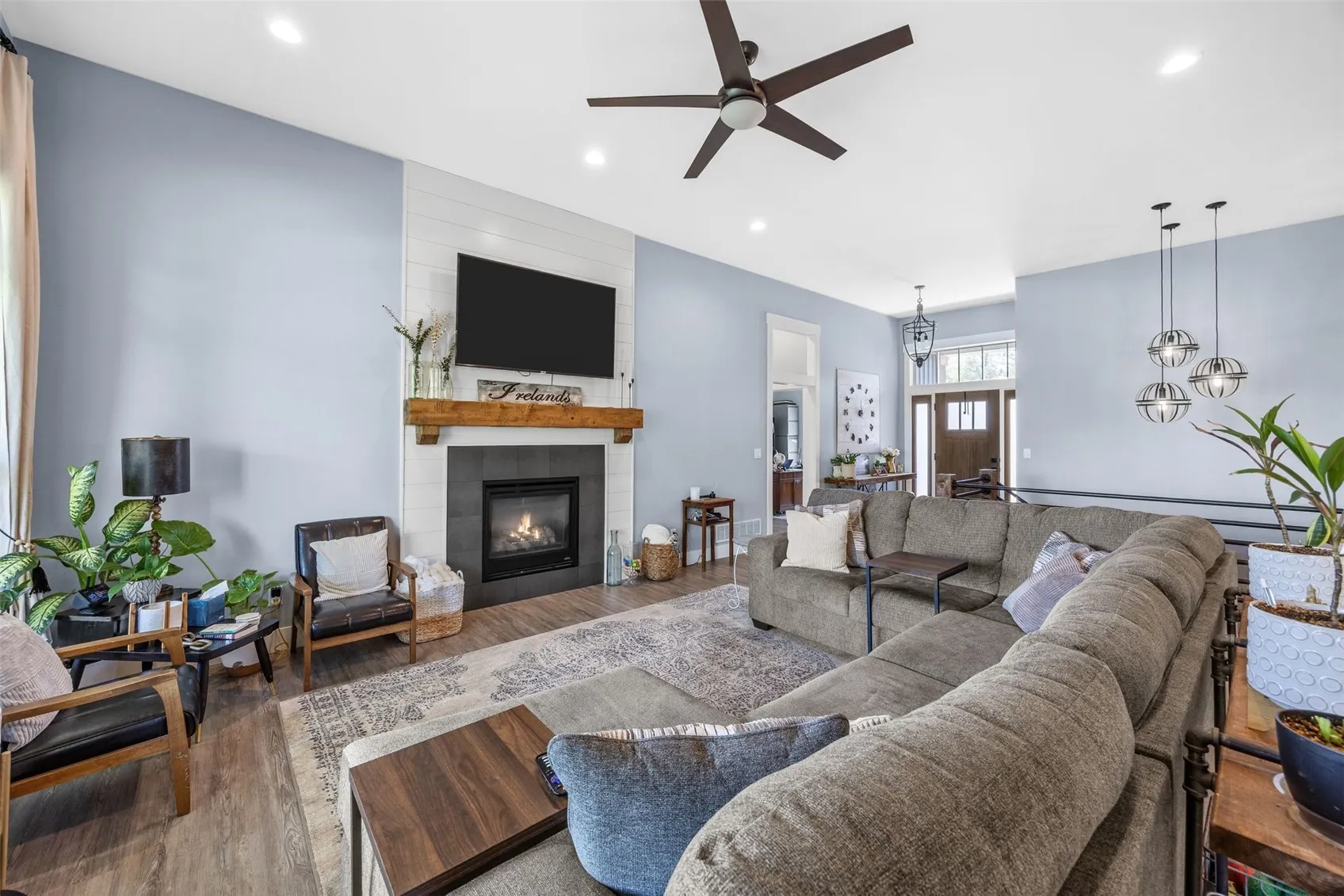 Open concept living room, kitchen, dining room.