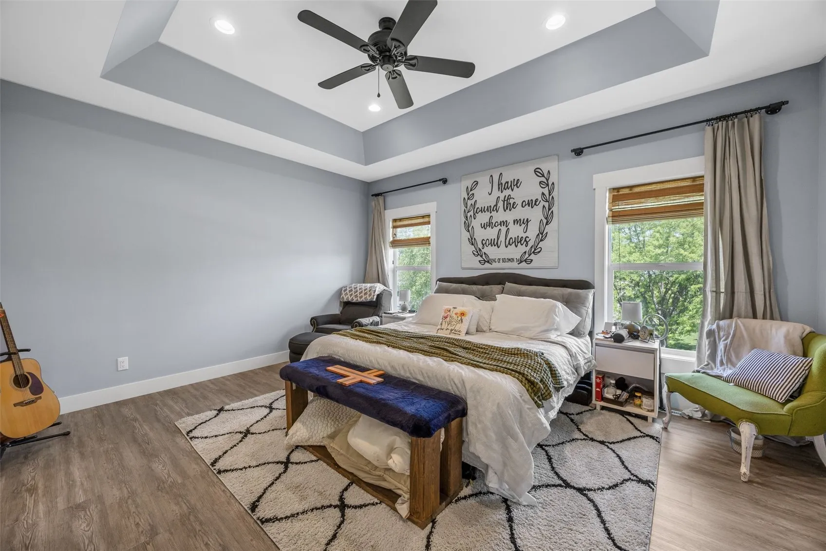 Primary bedroom is large and has trey ceilings.