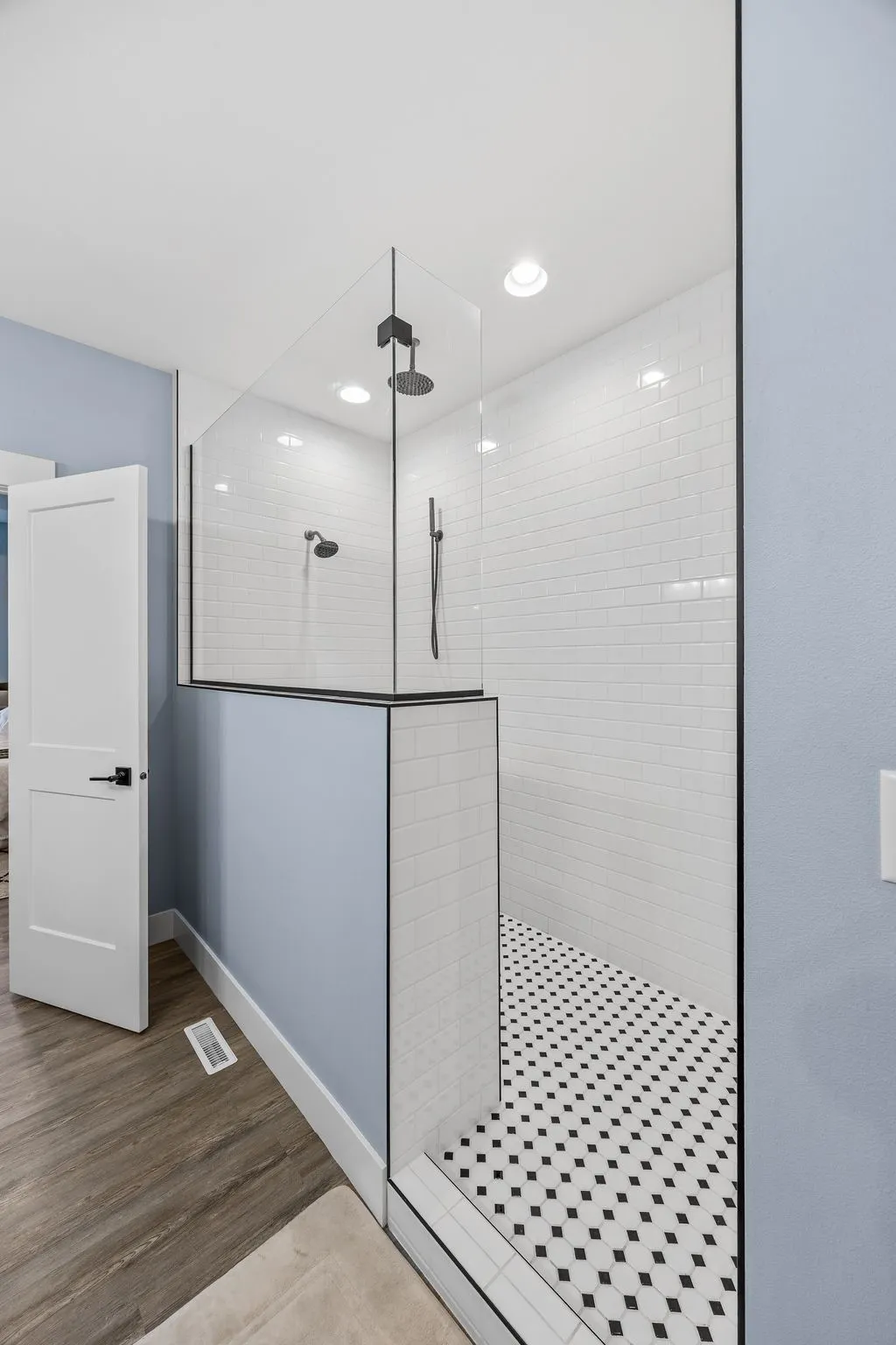 Plenty of room in the primary shower.