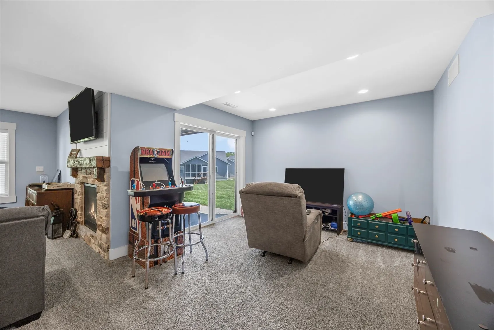 Video games anyone? Plus sliding glass door to the patio.