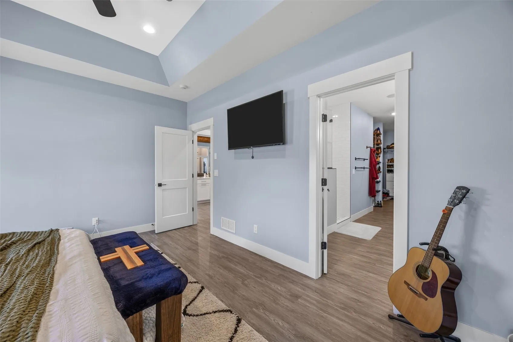 Primary bedroom is large and has trey ceilings.