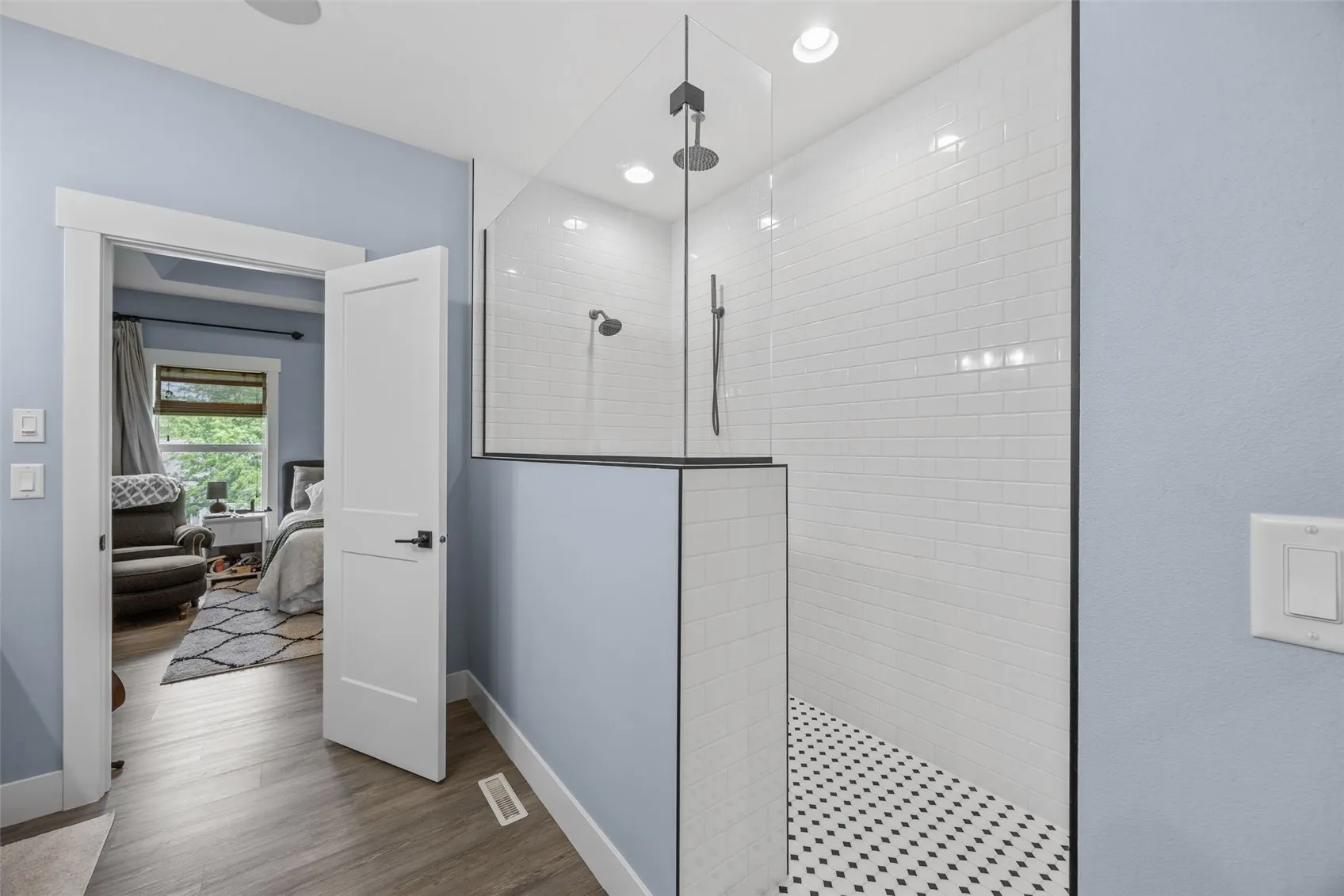 Walk-in shower with dual shower heads.