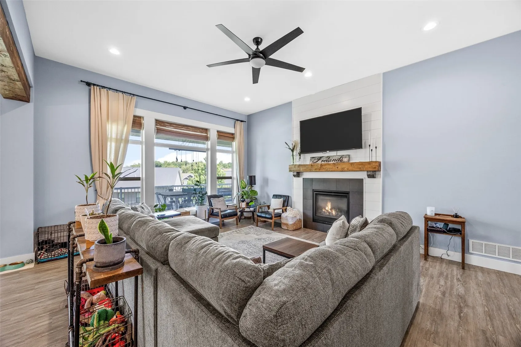 Open concept living room, kitchen, dining room.