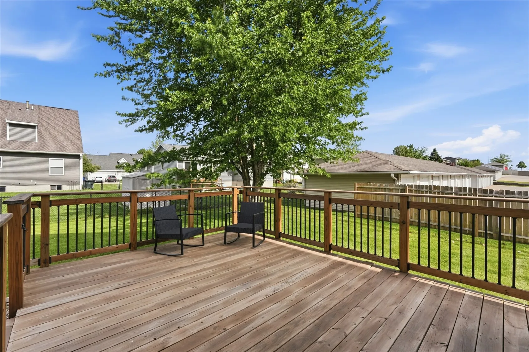 Large deck overlooking back of yard