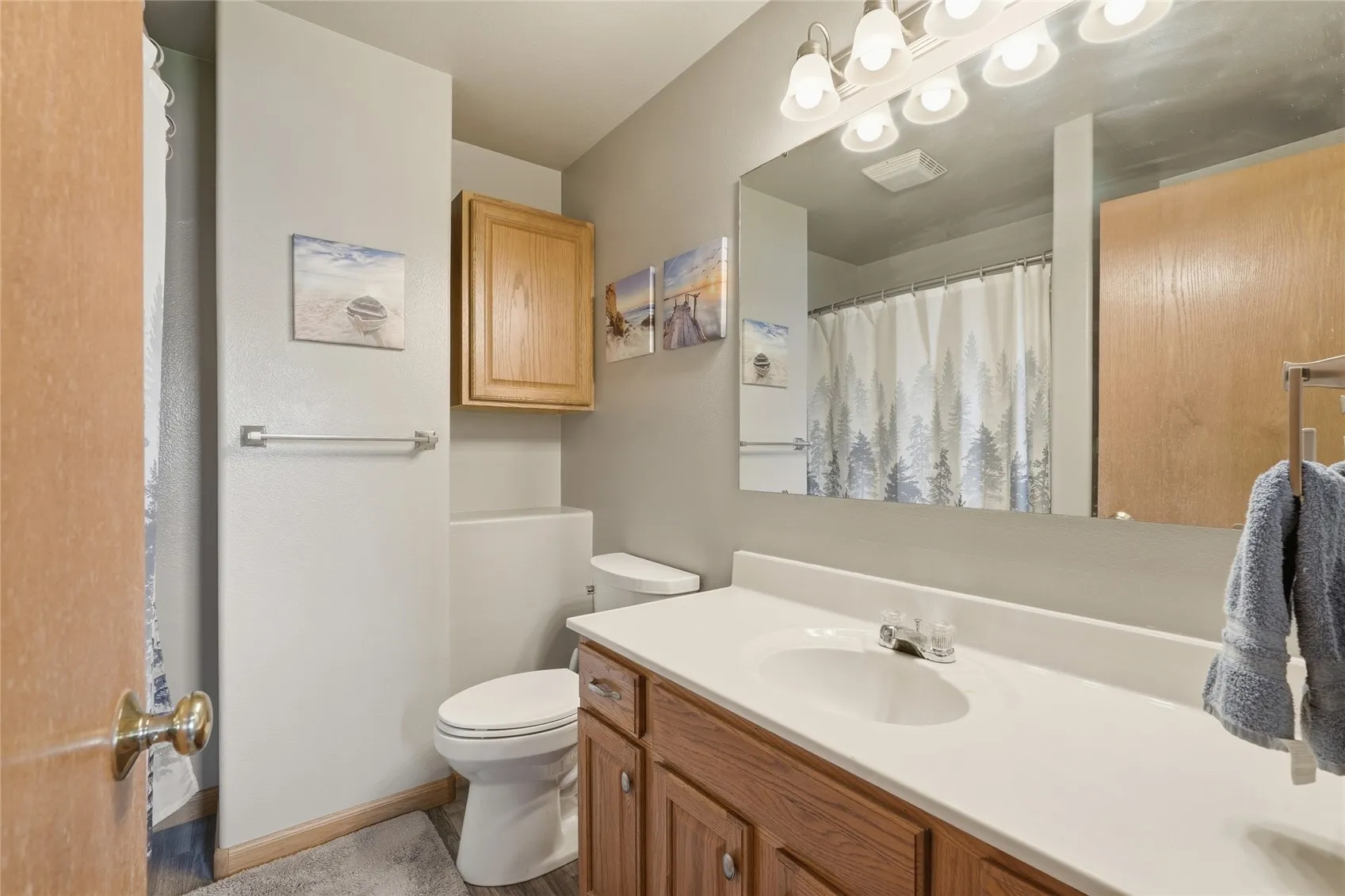 Full bathroom in hallway with additional door to primary bdrm