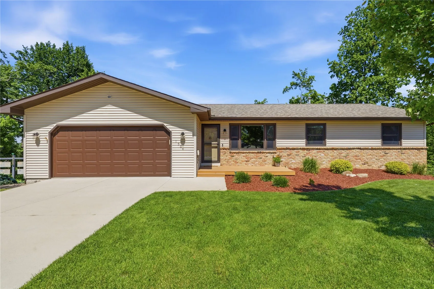beautifully landscaped front yard with irrigation system