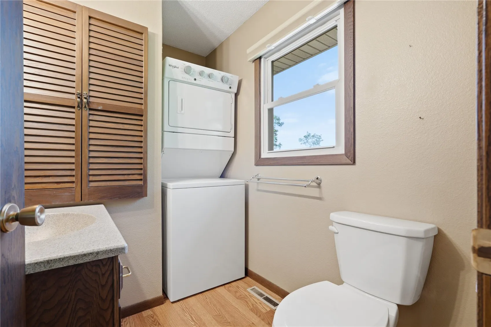 primary bath with stackable washer/dryer - was originally a shower and could be converted back