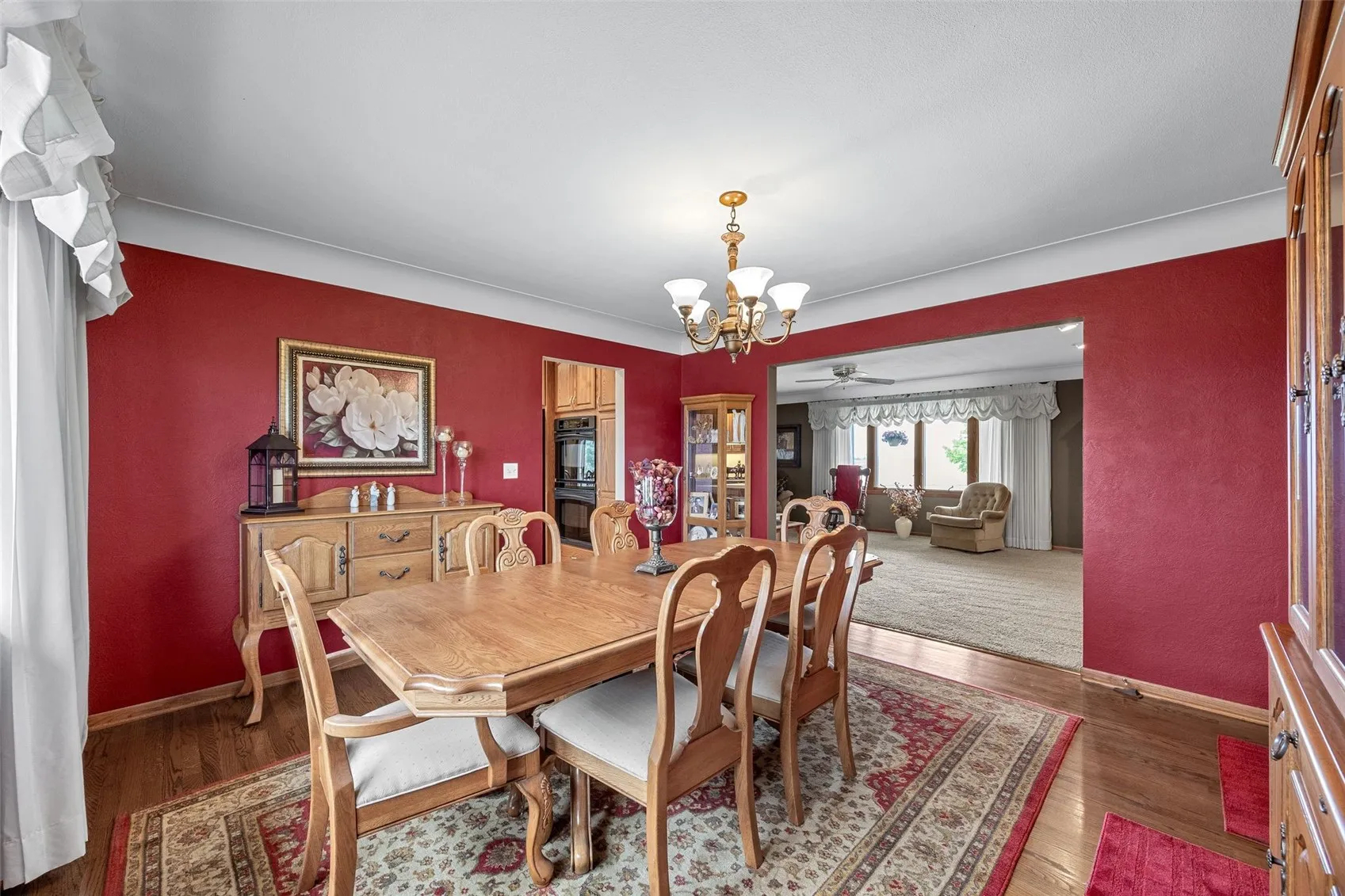 View from formal dining room into living room and kitchen