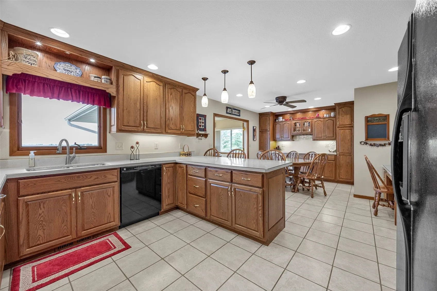 Moving from the formal dining room into the LARGE kitchen. Custom cabinets throughout.