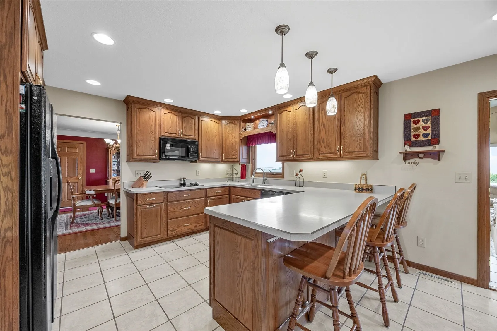 Breakfast counter in kitchen. Notice the excellent amount of storage space.