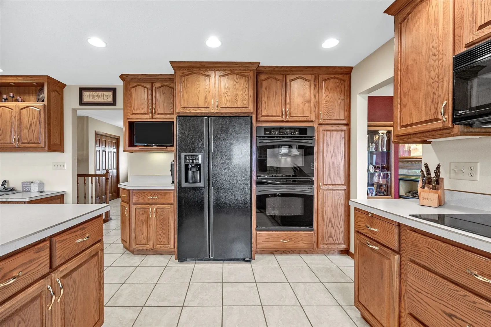 This picture shows the expanse of the space in the kitchen and the counter space.
