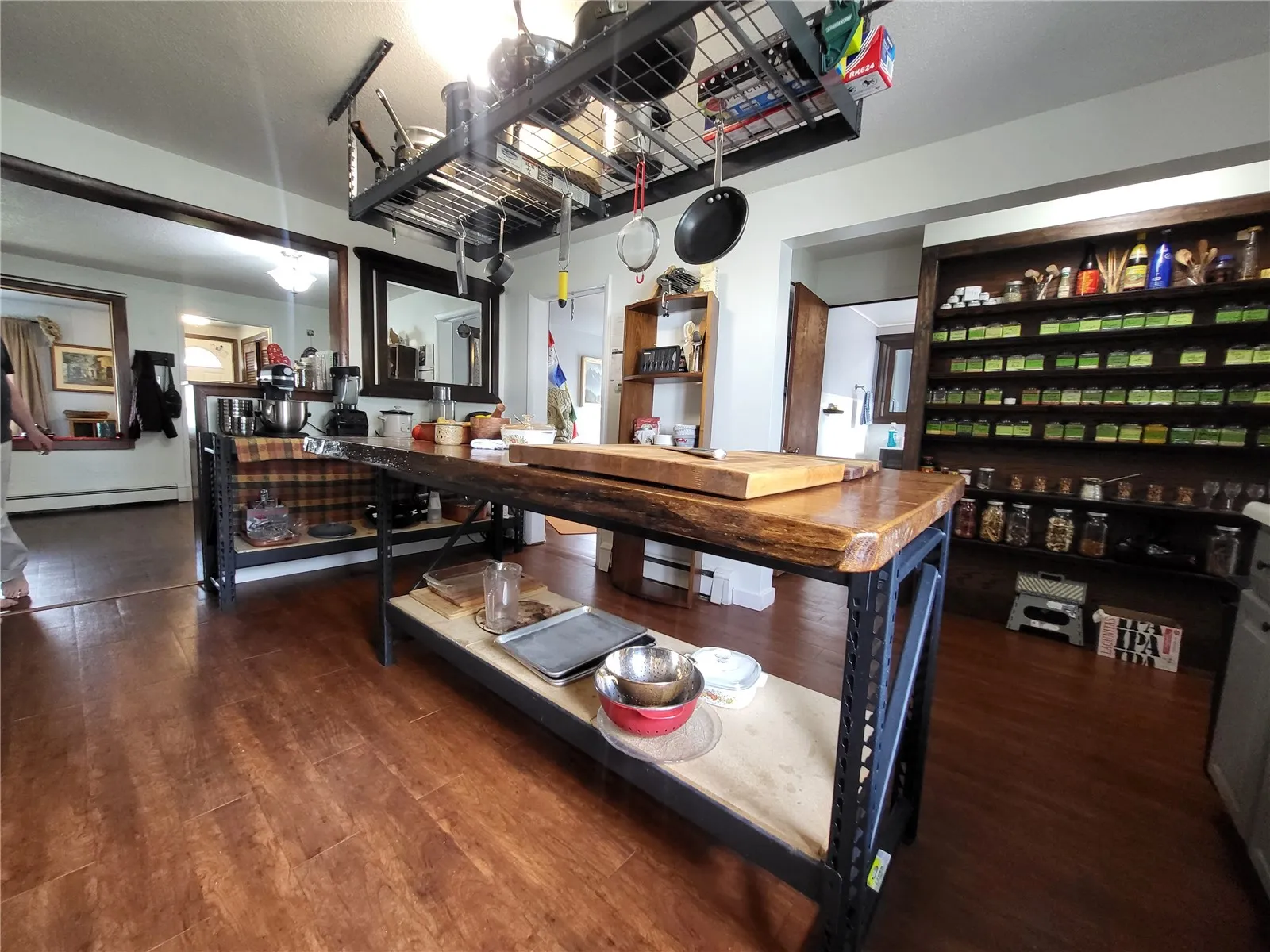 Custom built kitchen island w/overhead pot storage
