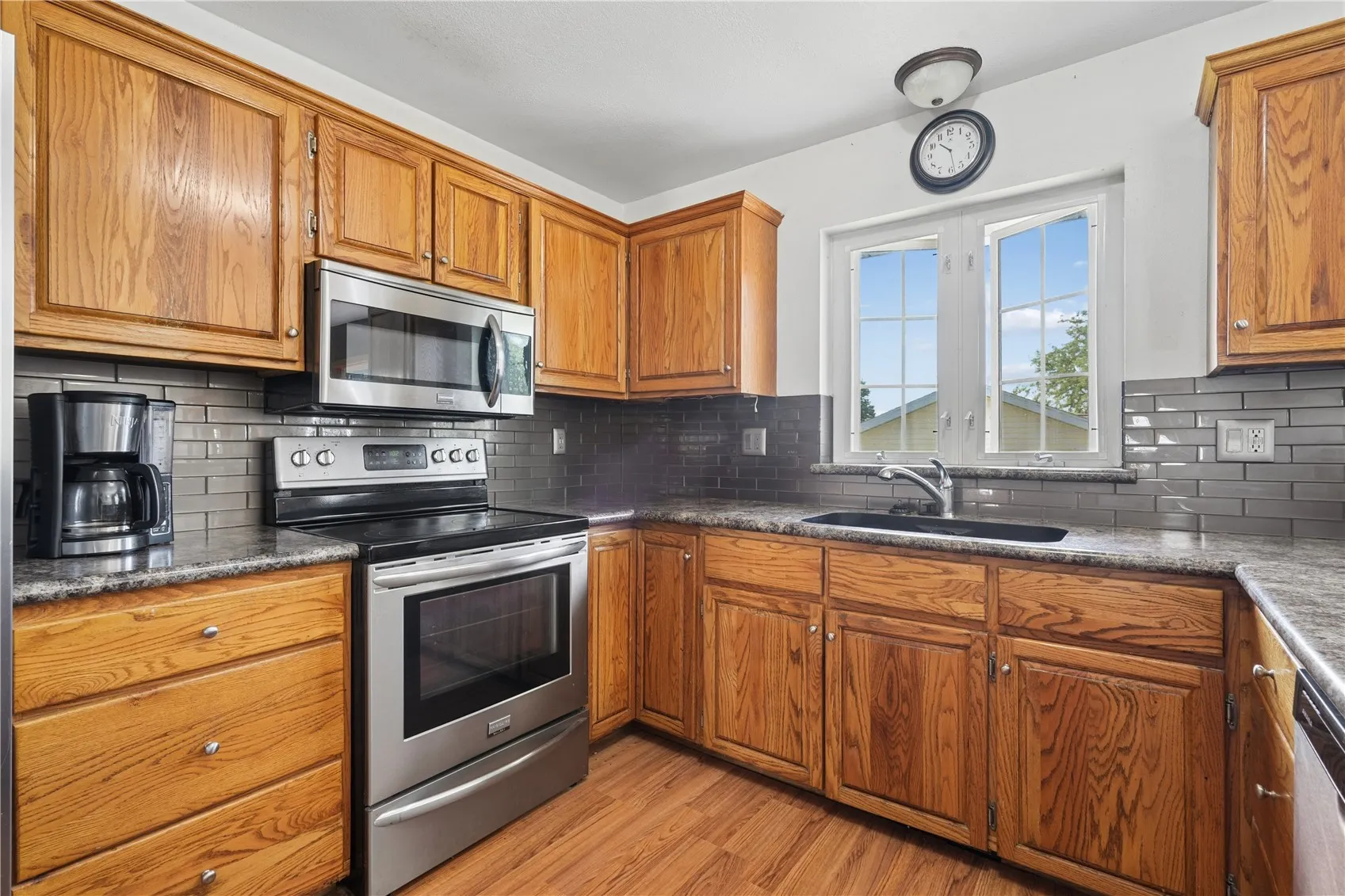 Kitchen with oak cabinets and flooring