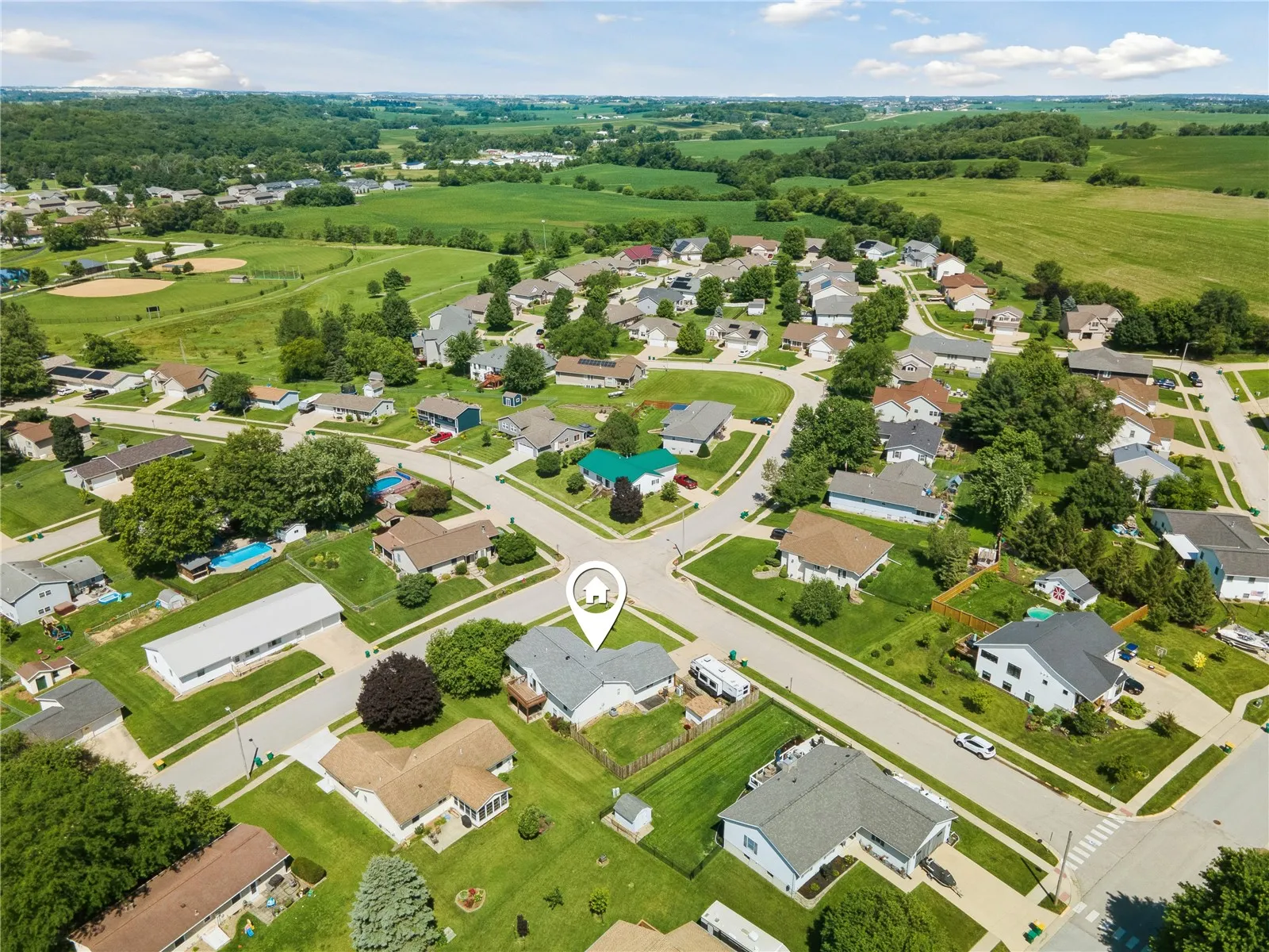 Aerial view of the home in neighborhood