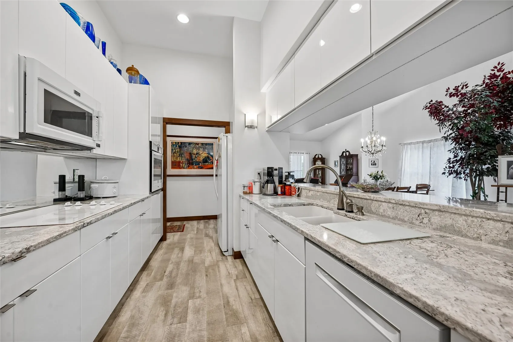 At the end of Kitchen - Hall to Garage - LL Entry - Closet & 1/2 Bath