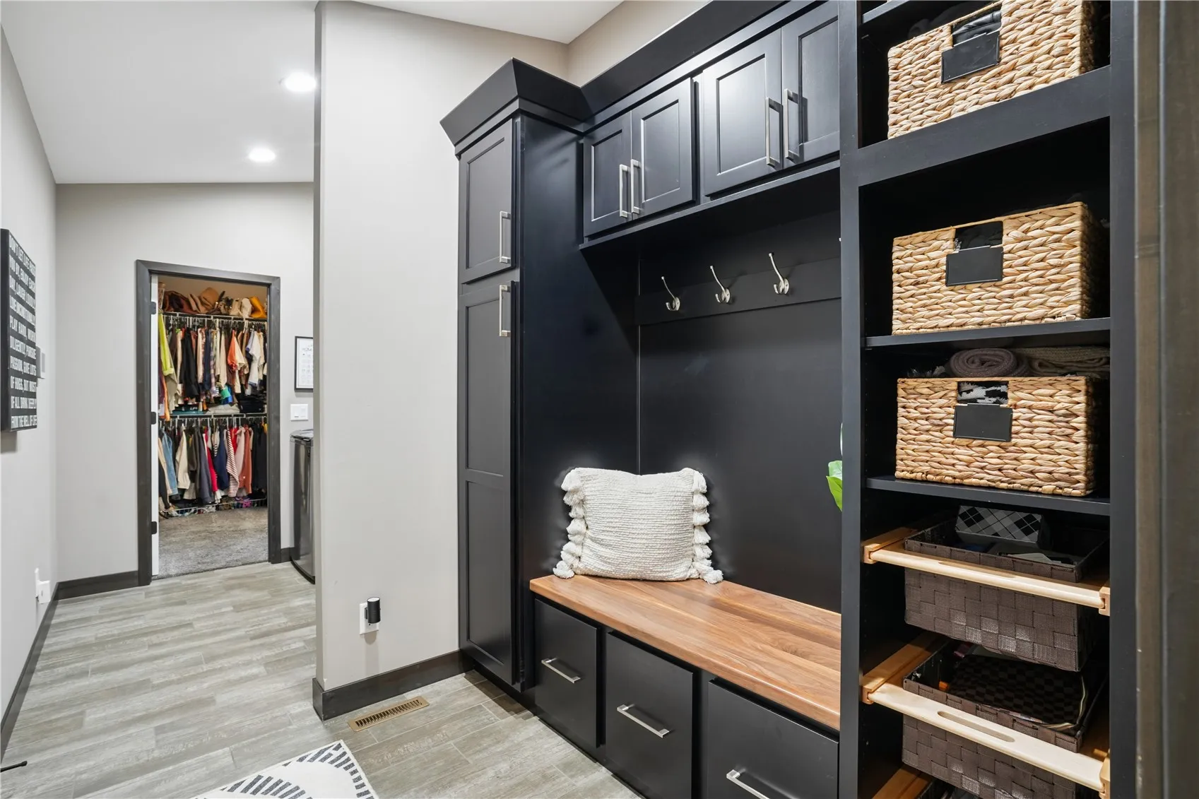 drop zone - leads to laundry & primary walk in closet
