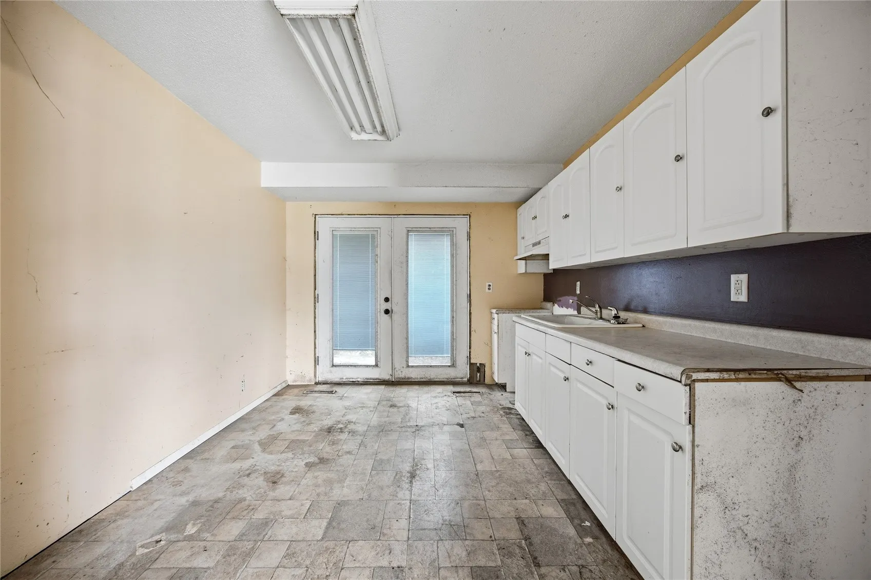 Kitchen and dining area. Doors to back deck.