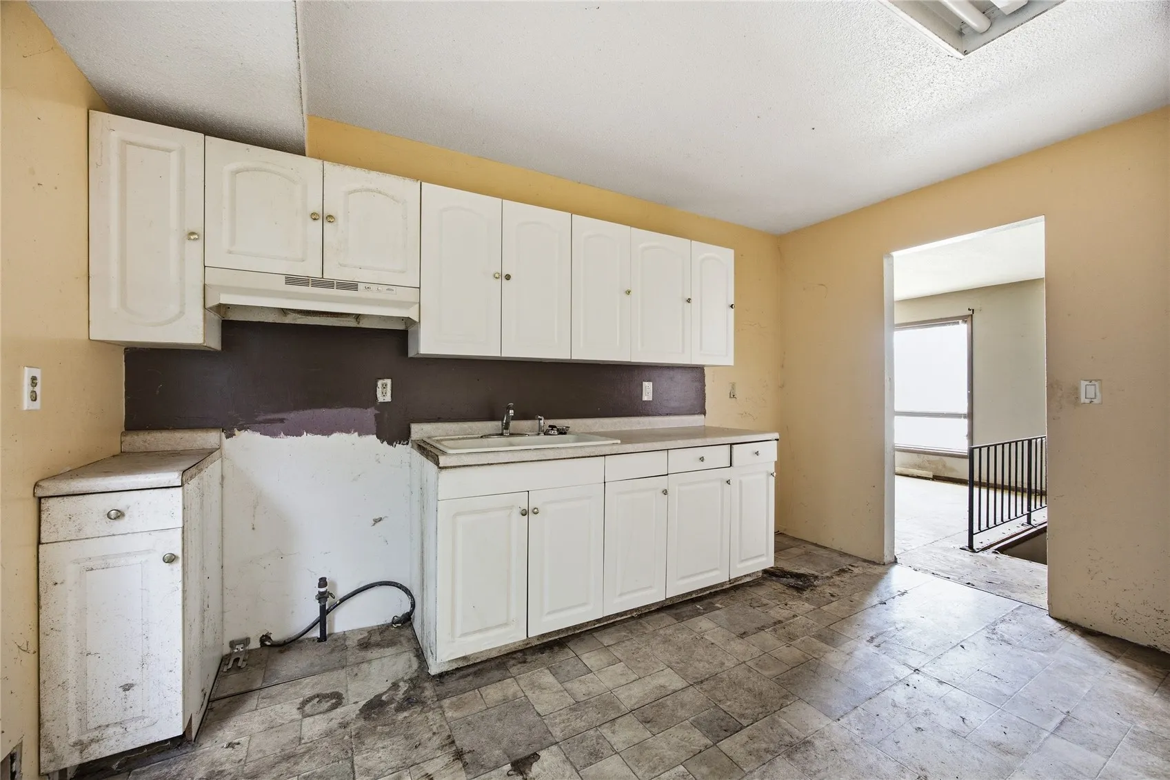 Kitchen appliances have been removed.