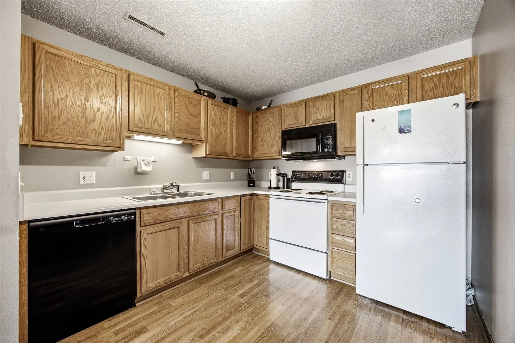 Functional kitchen with ample cabinetry.