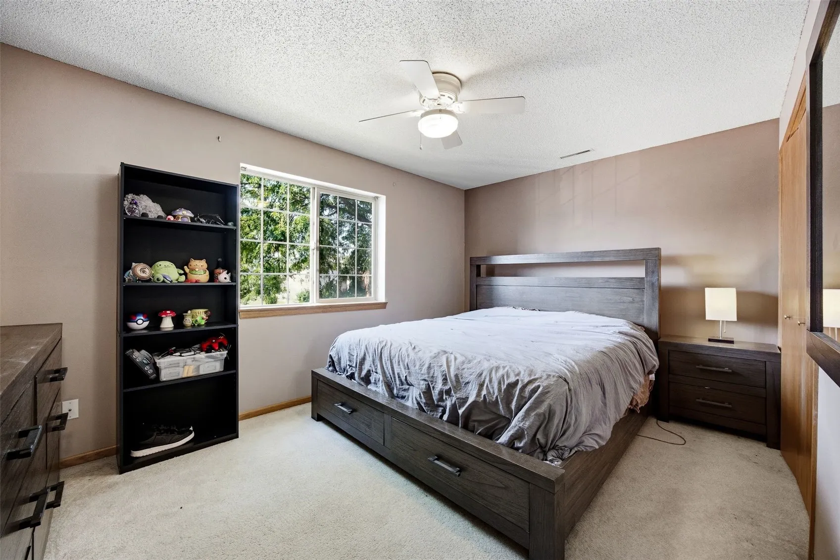Spacious main bedroom with room to unwind.
