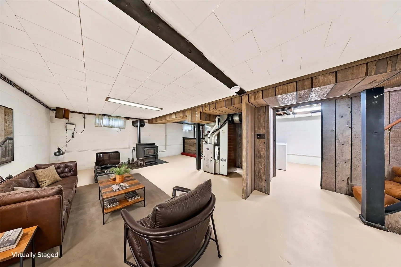Virtually staged basement rec area