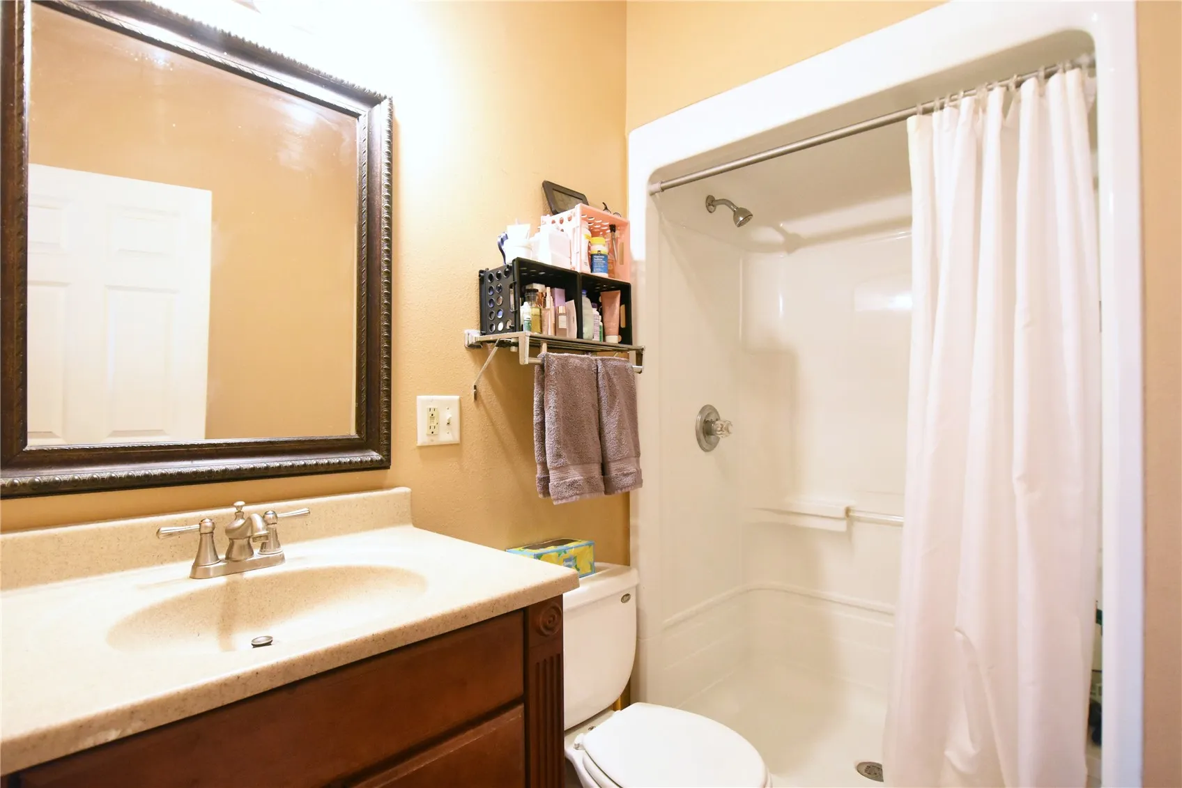 Hall bath with tiled flooring