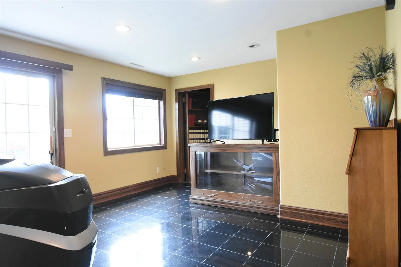 Hidden bookcase leads to theater room