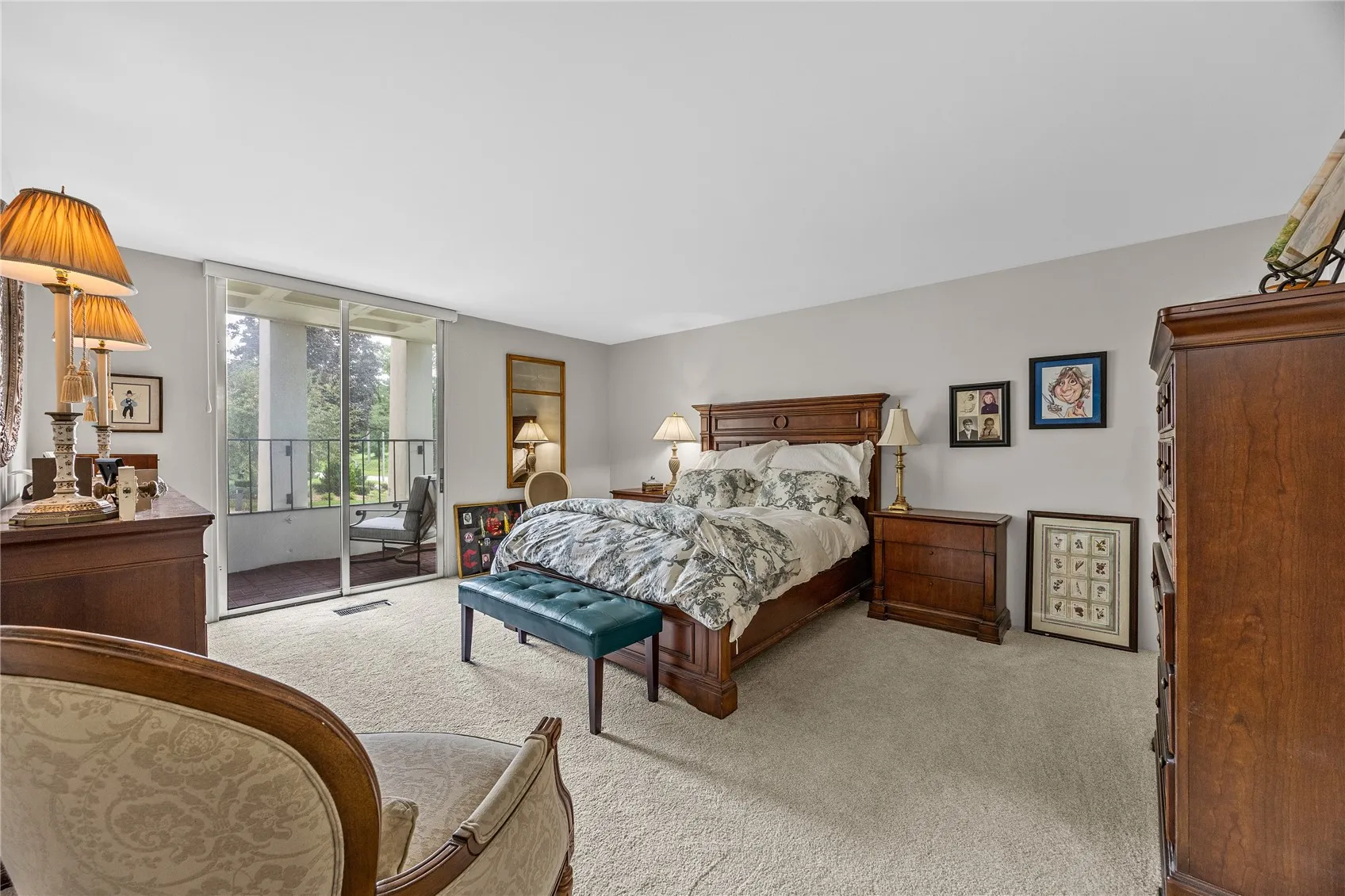 Primary bedroom with sliders to balcony.