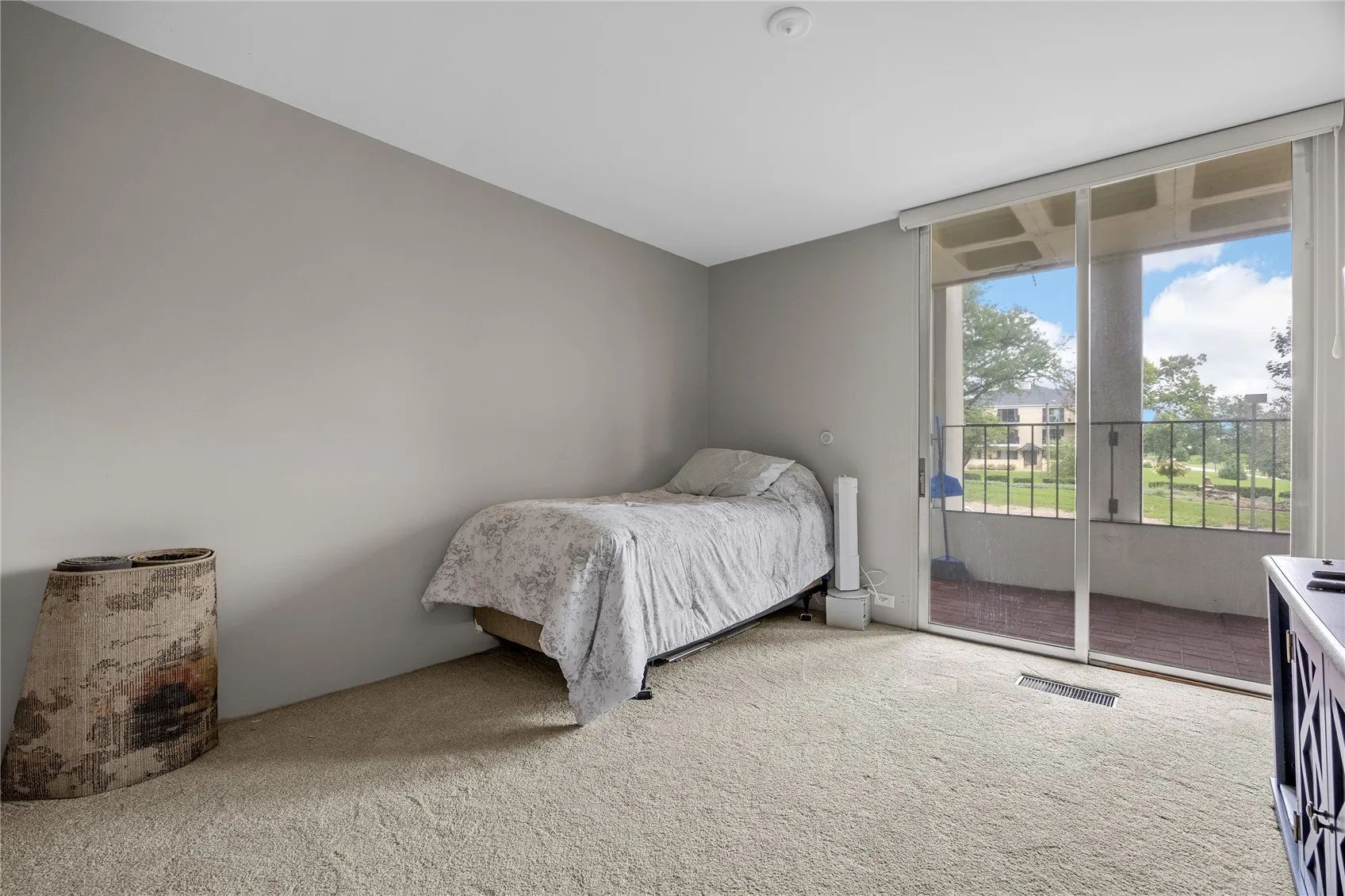 Bedroom #2 with sliders to balcony.