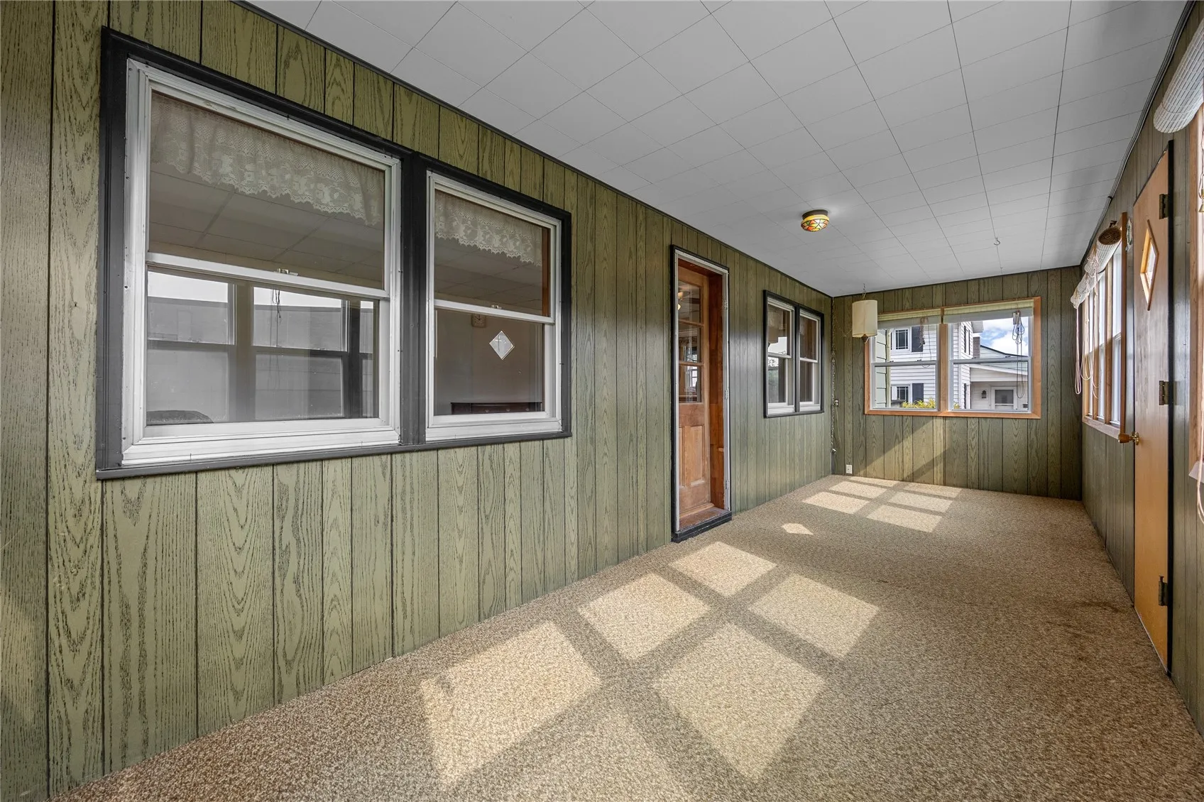 Enclosed front sun porch.