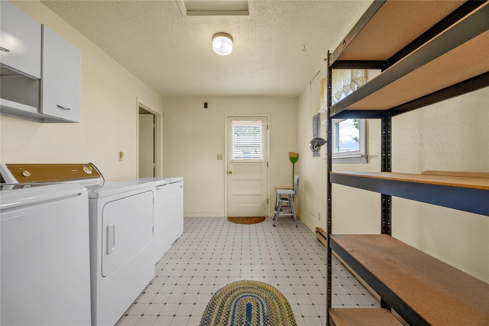 Storage space and access to backyard from laundry room.