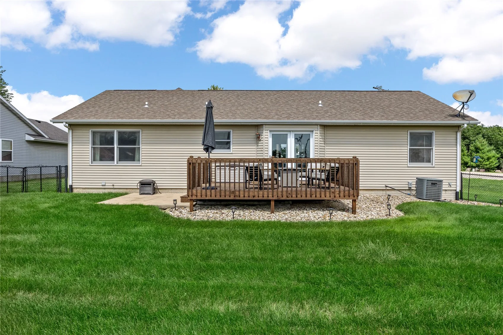 Good sized fenced in back yard with deck and patio.