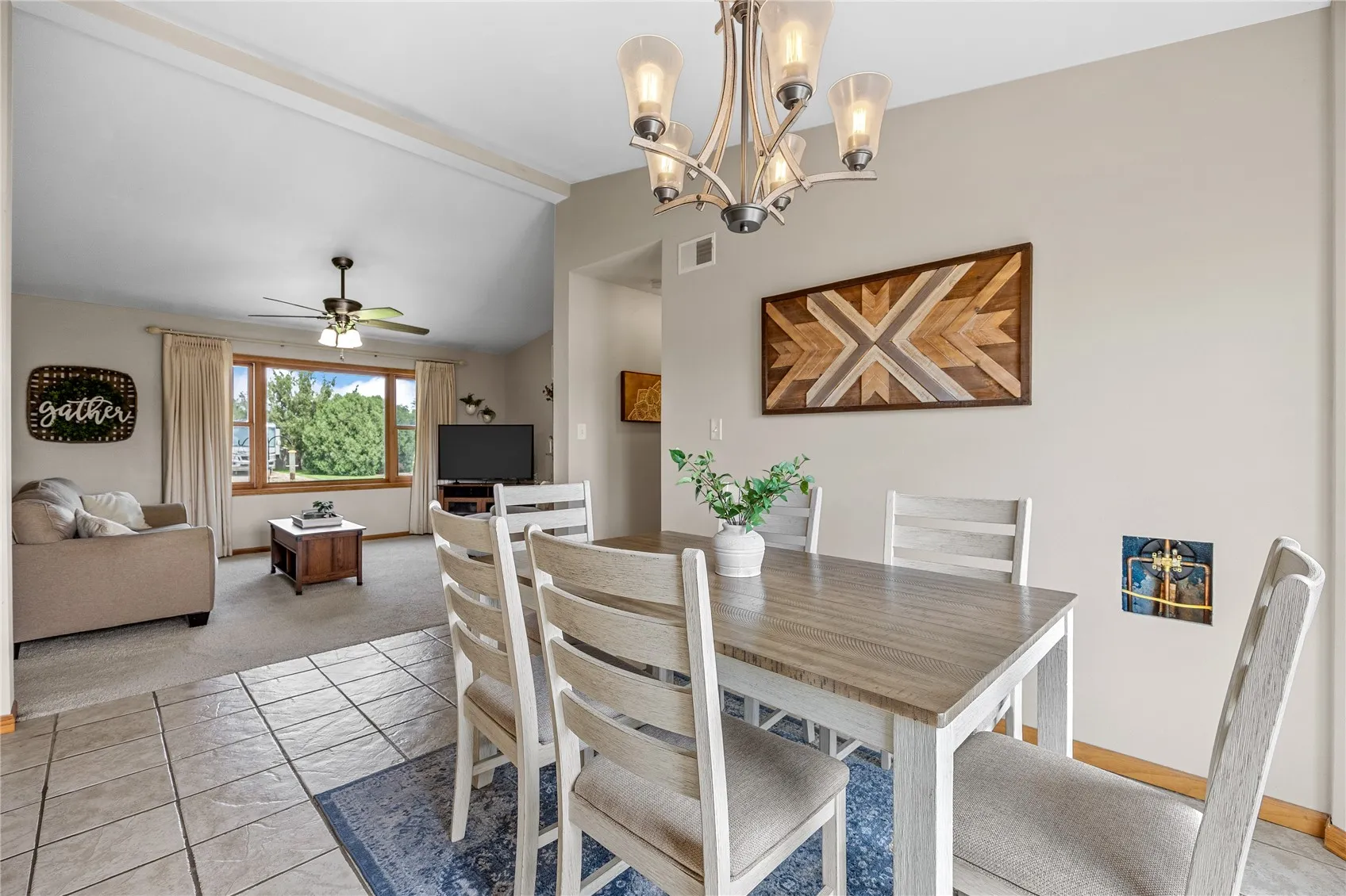 View of dining room and living room from kitchen.