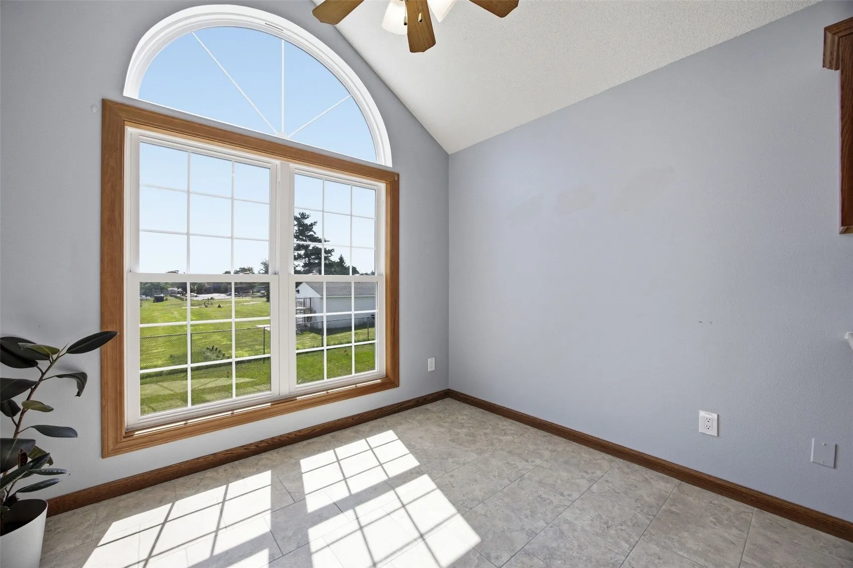 oversized windows drench this upper unit with beautiful light