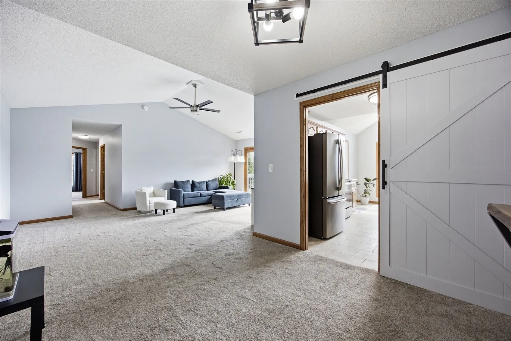 Updated sleek sliding door offers a stylish option to close off the kitchen if you wish