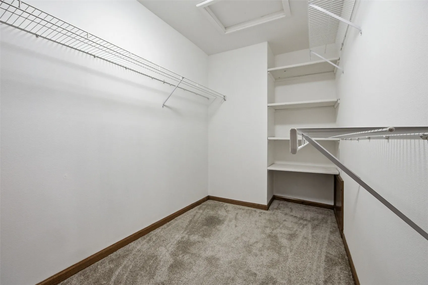 walk in closet in primary bedroom