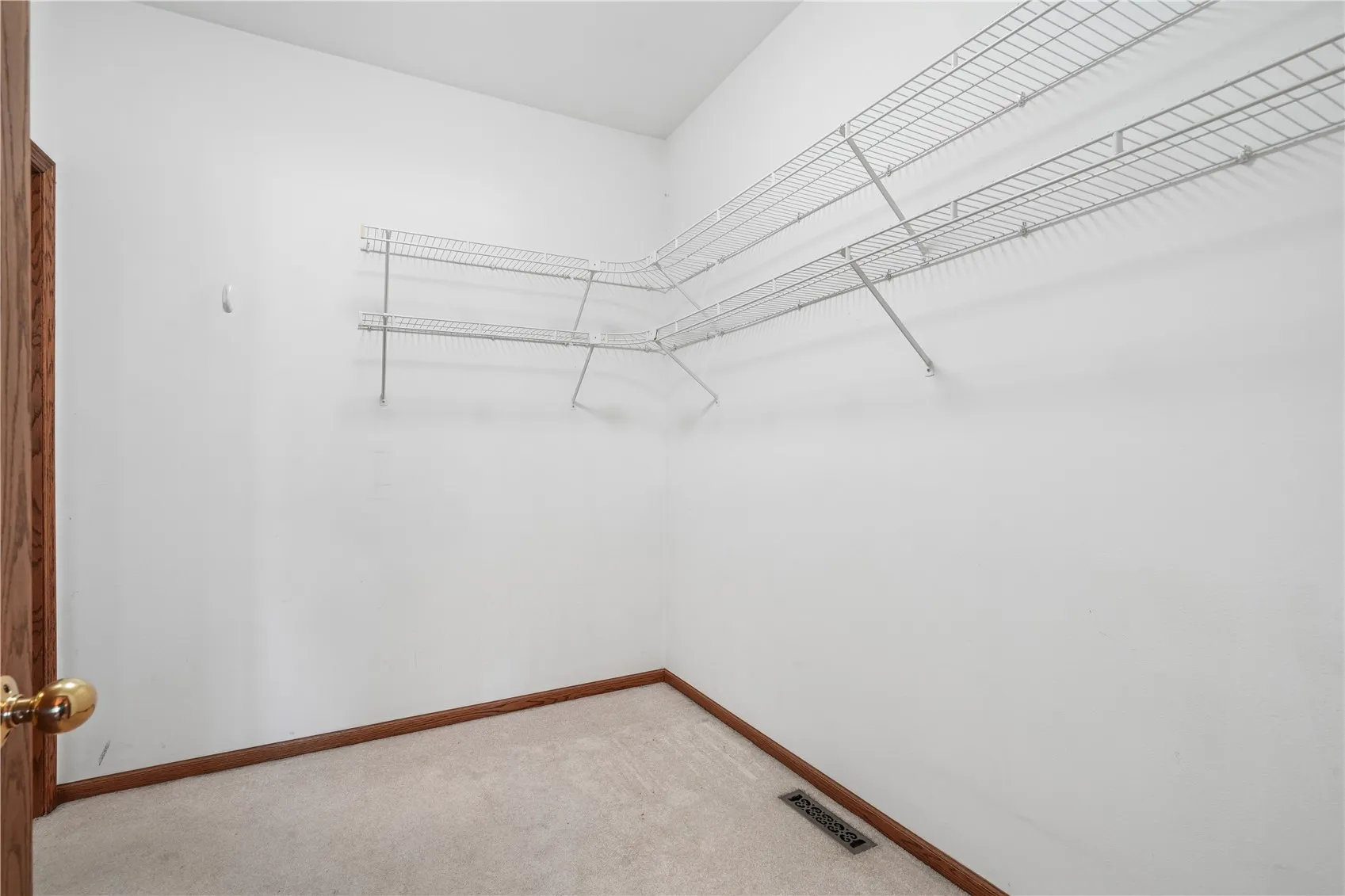 Primary bedroom walk-in closet