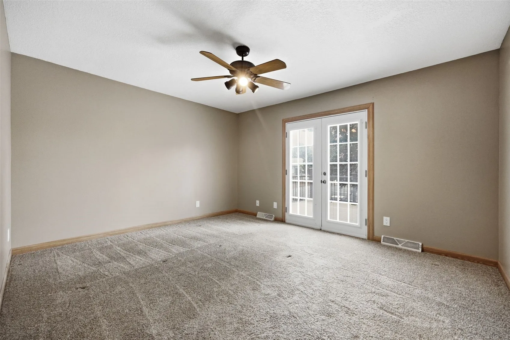 Primary Bedroom with French Doors to the Deck