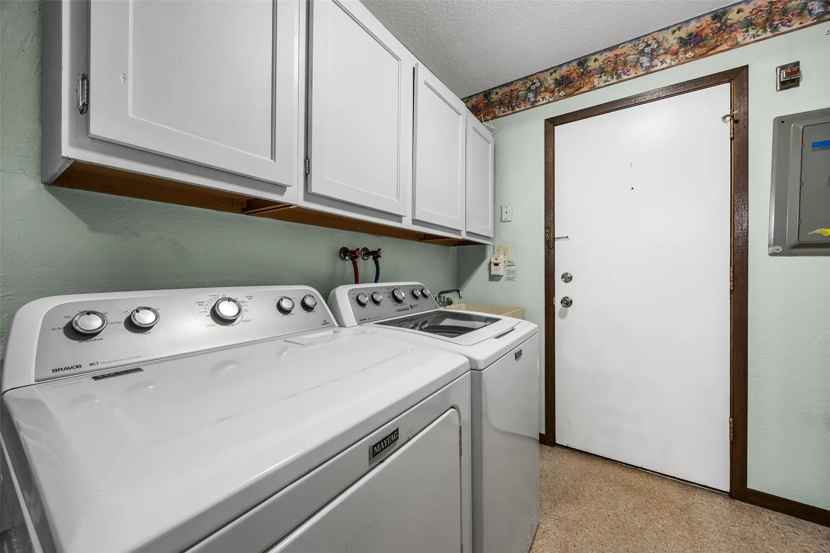 laundry- with door to rear hallway and secure storage closet