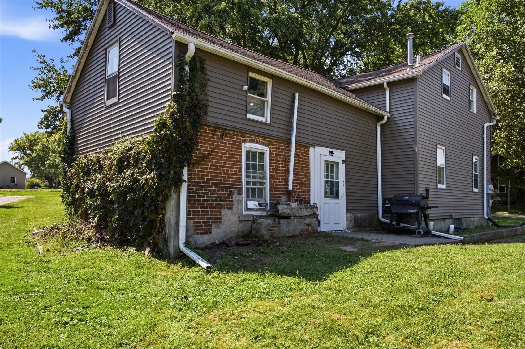 Backside of home & upper level unit entrance